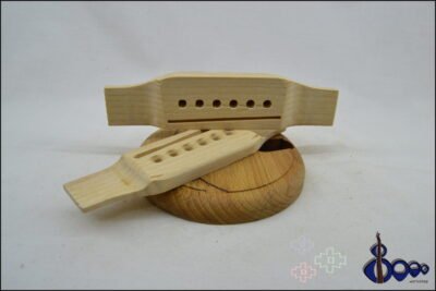 Western acoustic guitar bridge